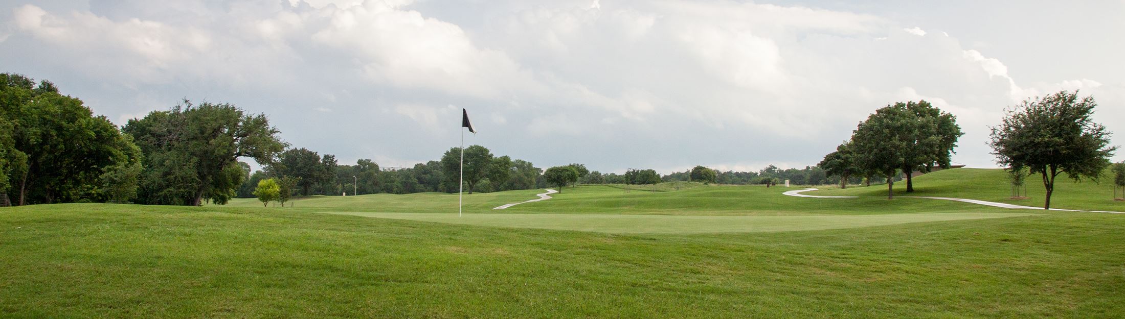 A green and flag on a hole at the Landa Park Golf Course in New Braunfels