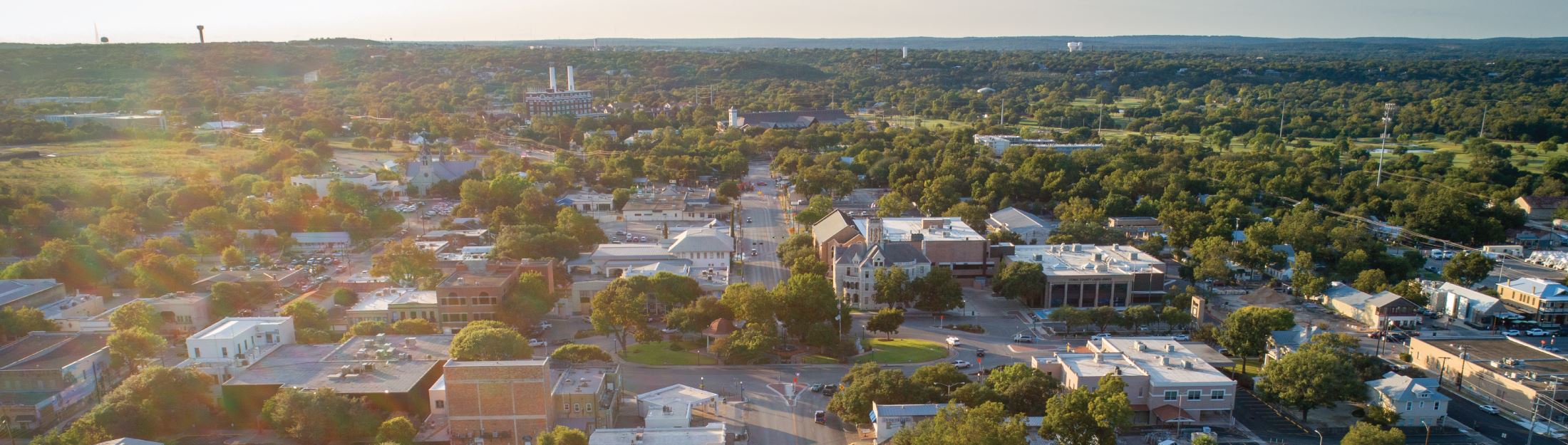 An aerial view of downtown New Braunfels at sunset