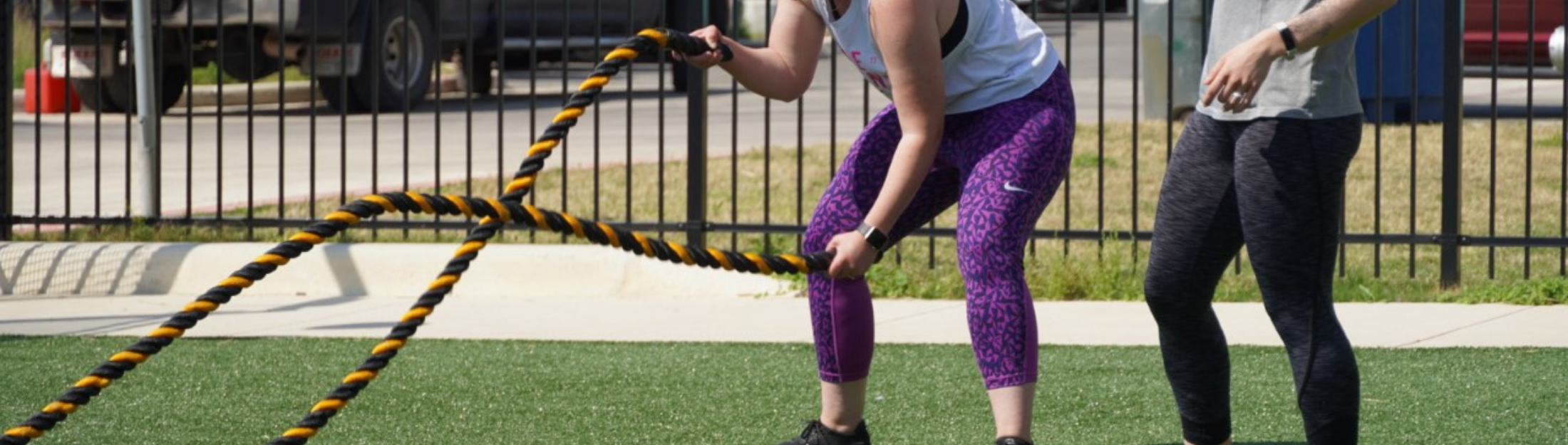 Das Rec member uses large ropes to exercise outdoors