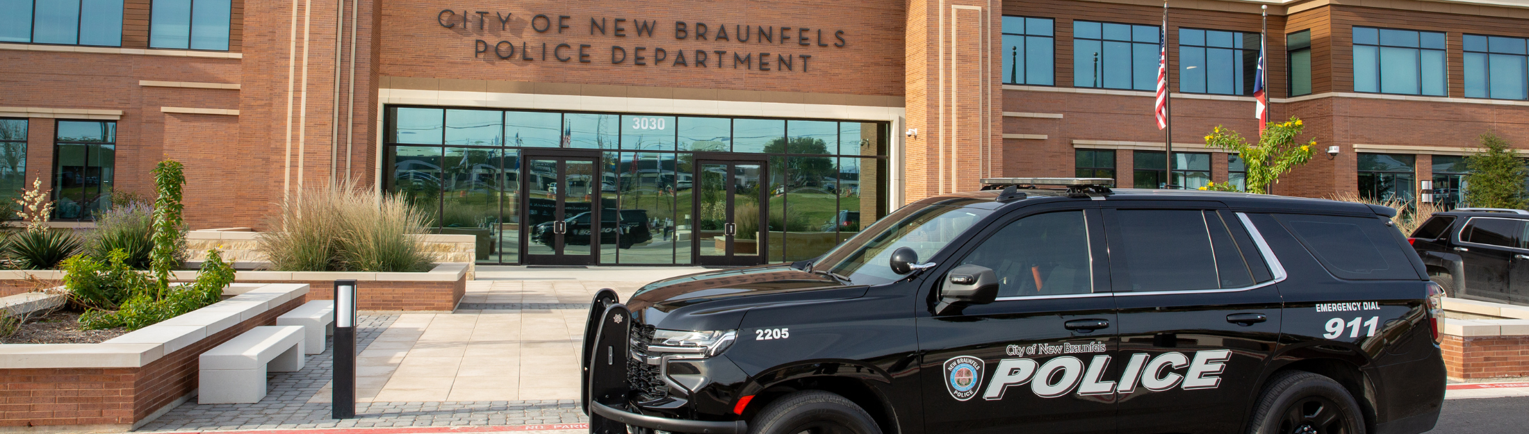 New Braunfels Police patrol car in front of NBPD Headquarters