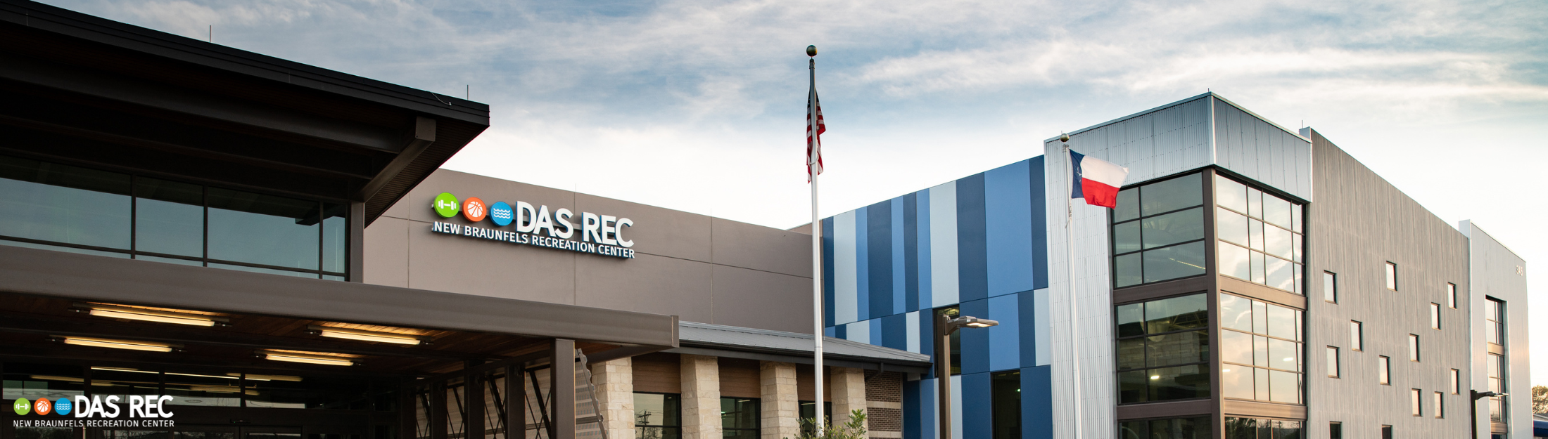 Exterior view of Das Rec with flagpole and signage