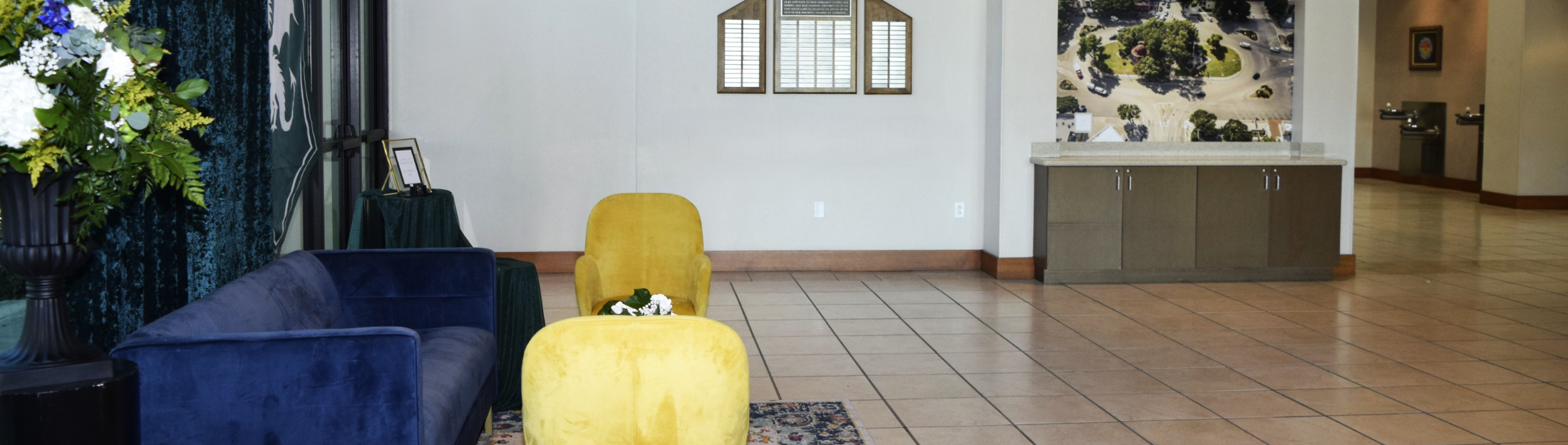 Seguin Ave Side of the Civic Center Lobby featuring Velvet Furniture and water fountains